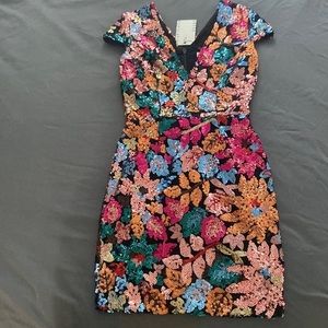 Short cocktail dress with sequin detailing. Size S. Brand new (tags attached).